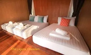 Comfortable room at The Laguna Cheow Lan, houseboat on the Rajjaprabha Dam lake.