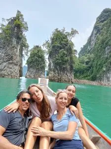 Customers posing in front of the islets in the Cheow Lan Lake in Khao Sok.