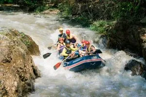 Foreign tourists rafting at Ton Pariwat Waterfall in Phang-nga.