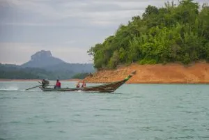 Tourists riding a longtail boat on the Cheow Lan Lake, Khao Sok National Park.