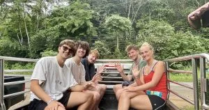 Tourists riding in a pickup truck in Khao Sok National Park.