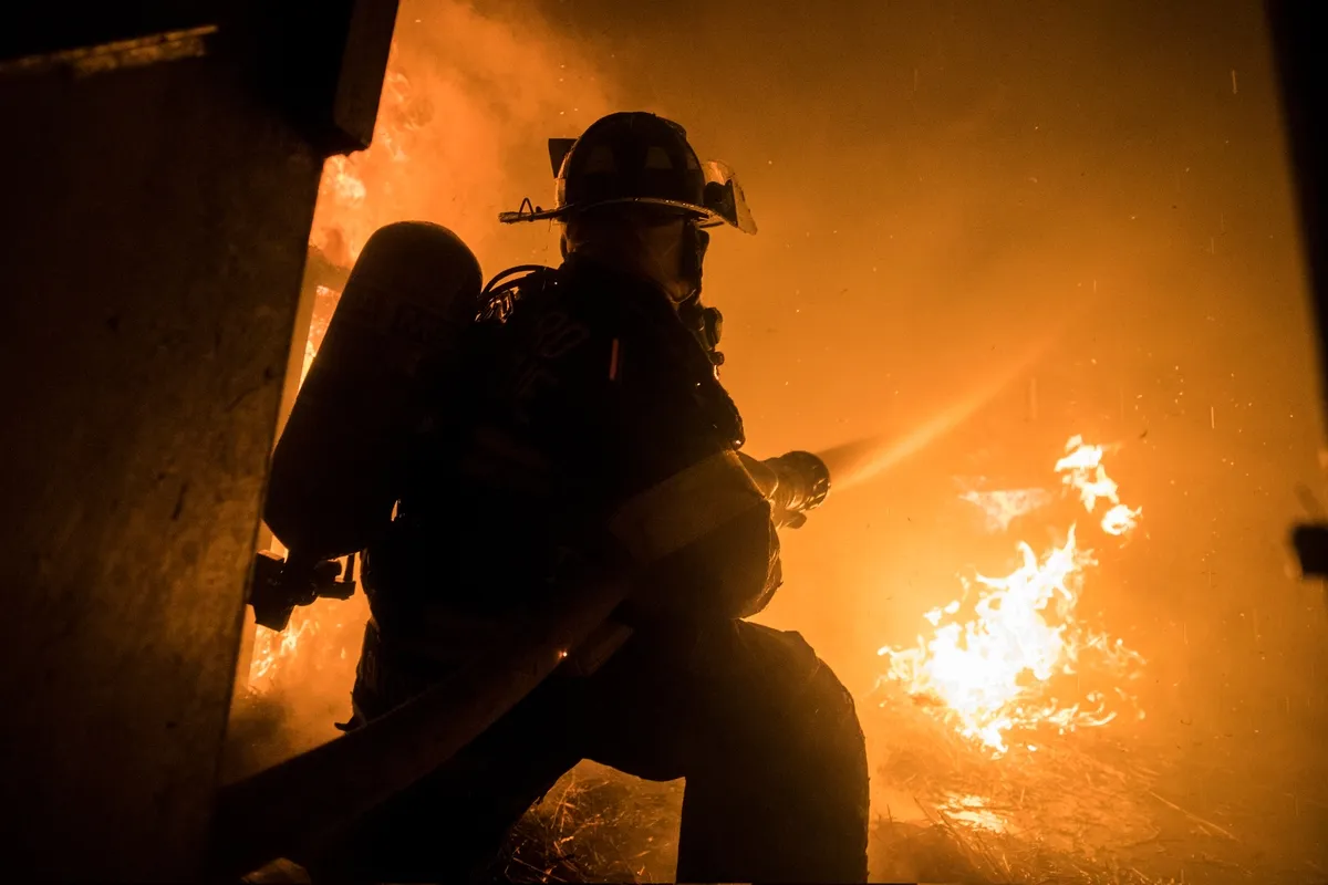 A Fighterfighter battles a blaze.