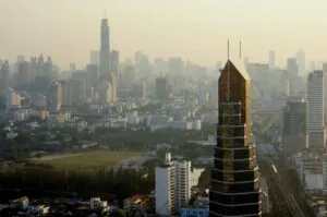 Dust, smoke haze and smogin Bangkok from a roof of Phaholyothin Place tower in Samsen Nai.