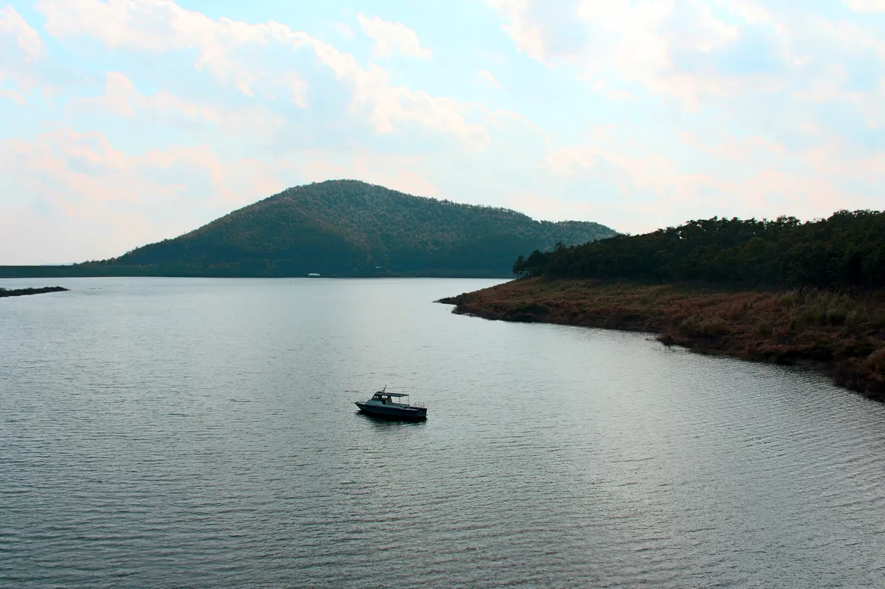 A boat sailing in a reservoir in Chiang Mai