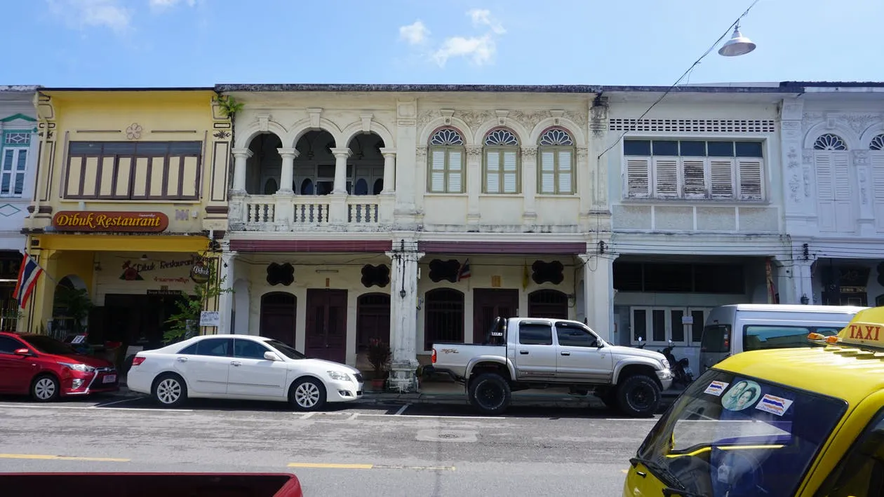 Cars and taxi parked on the street in Phuket