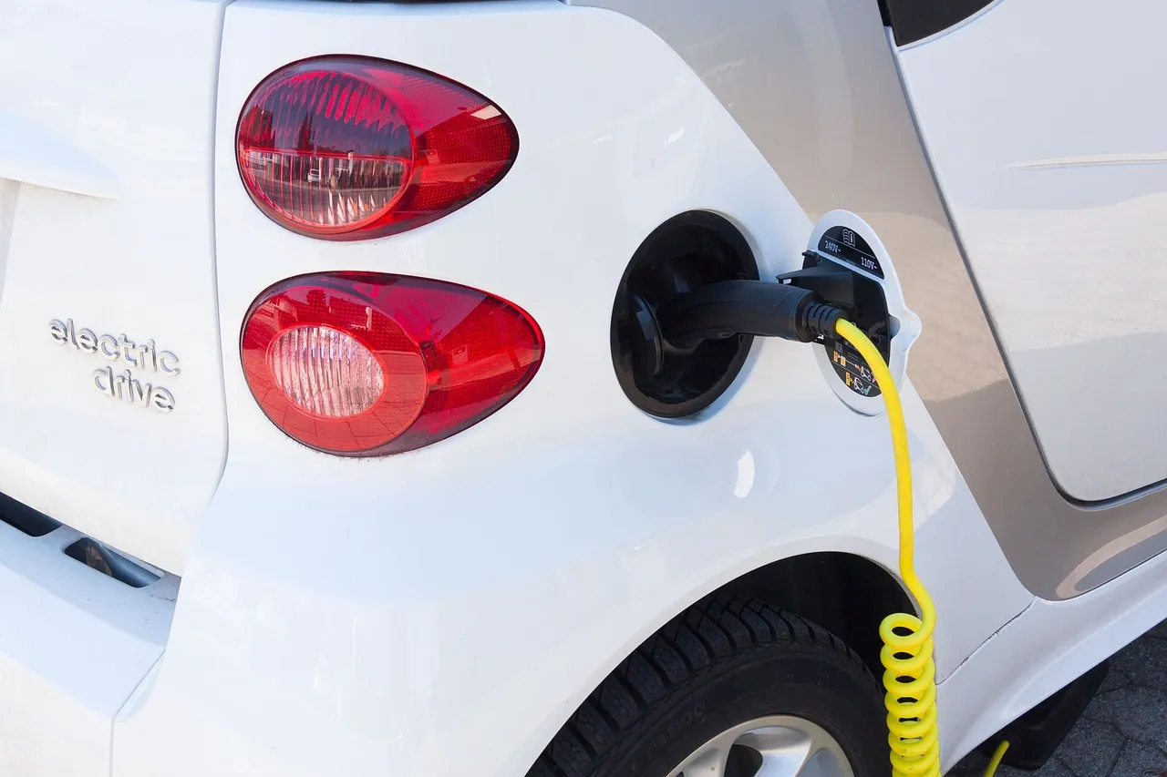 Electric car charging at EV charging station