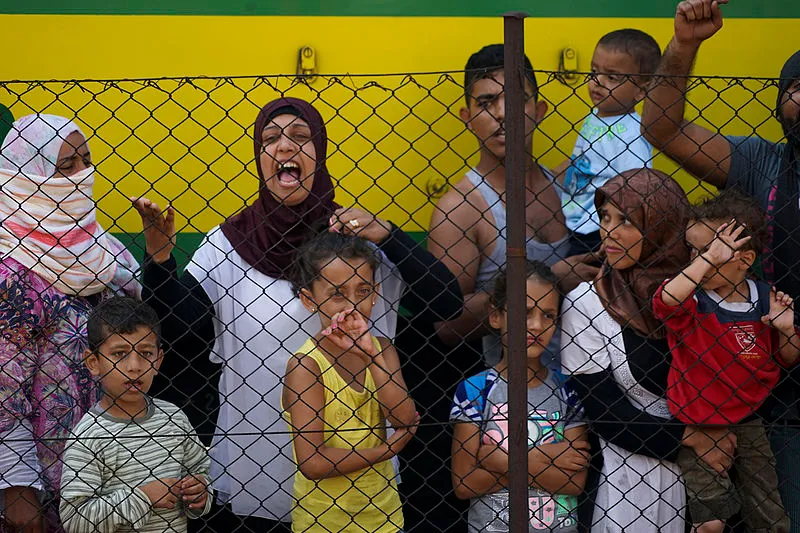 'Syrian refugees' striking at the platform of Budapest Keleti railway