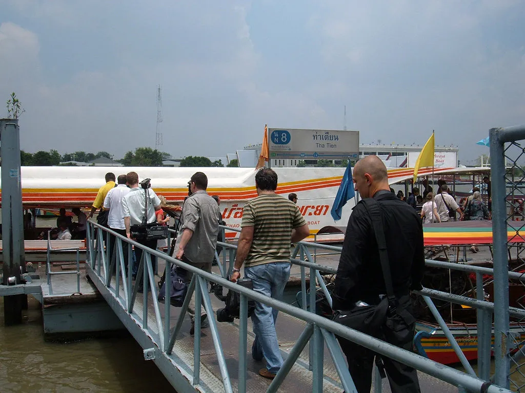 Foreigners boarding a Chao Praya ferry in Bangkok