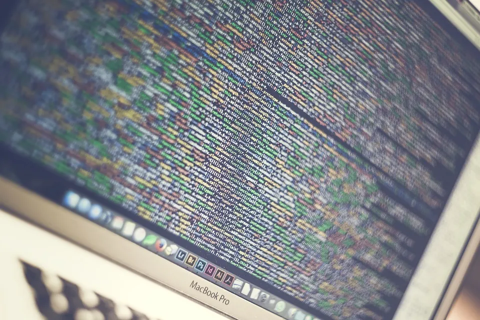 MacBook Pro displaying lines of code