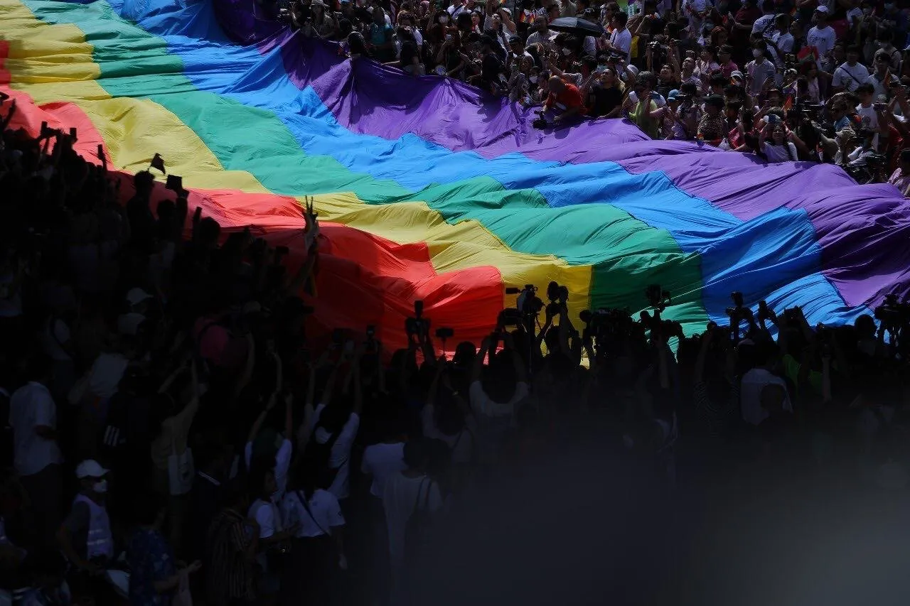 Thousands of LGBTQ+ people join Pride celebrations in Bangkok.