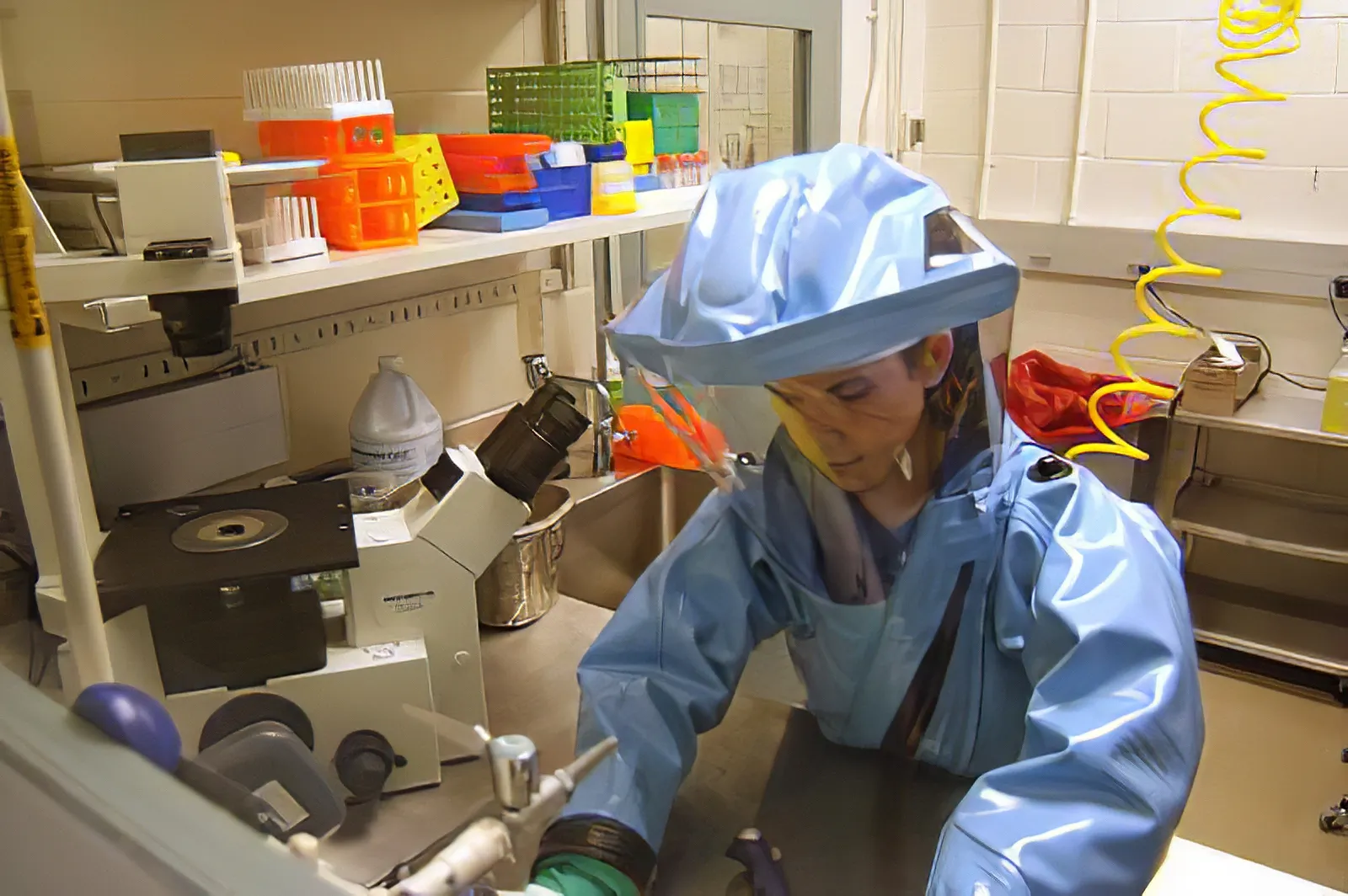Doctor in the laboratory with a biological fluids tube for analysis and sampling of virus