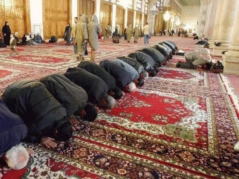 Muslim men praying