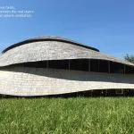 The Panyaden School Sport Hall in Chiang Mai, viewed from rice fields