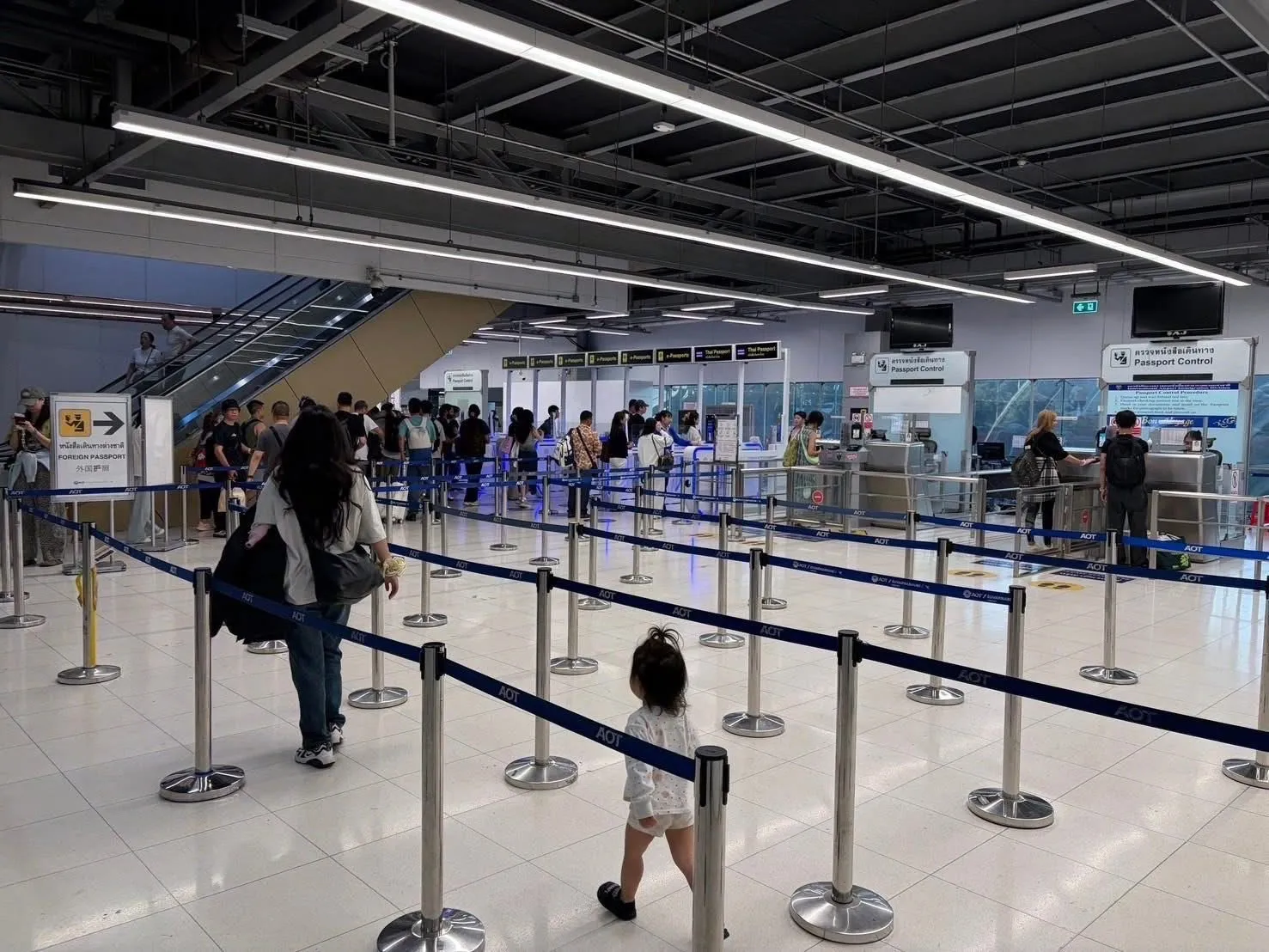 Passport control at the departure area of the Immigration office at Suvarnabhumi Airport in Bangkok.