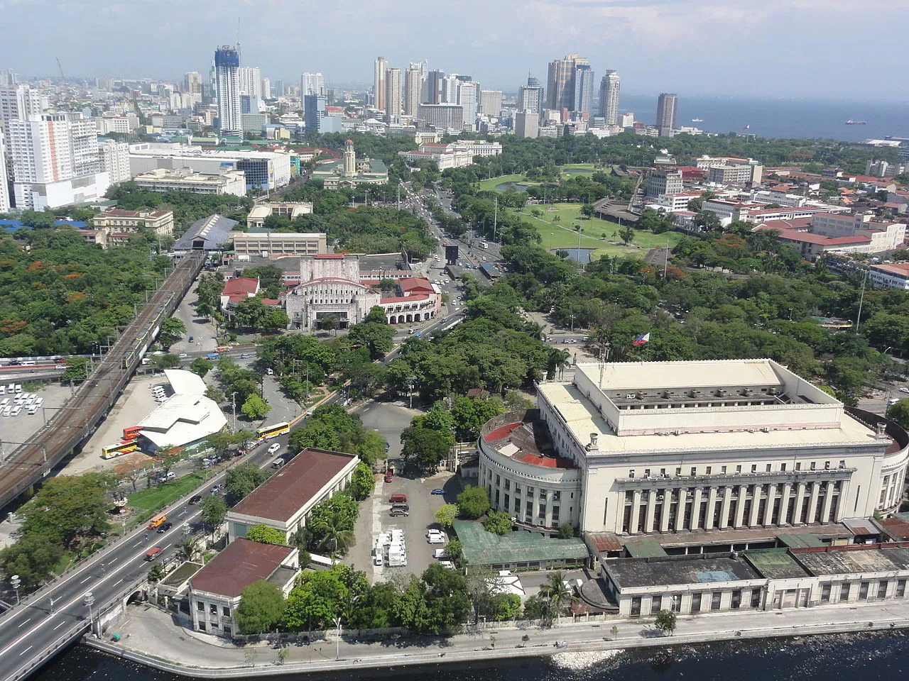The skyline of Manila with the Manila Central Post Office on the foreground