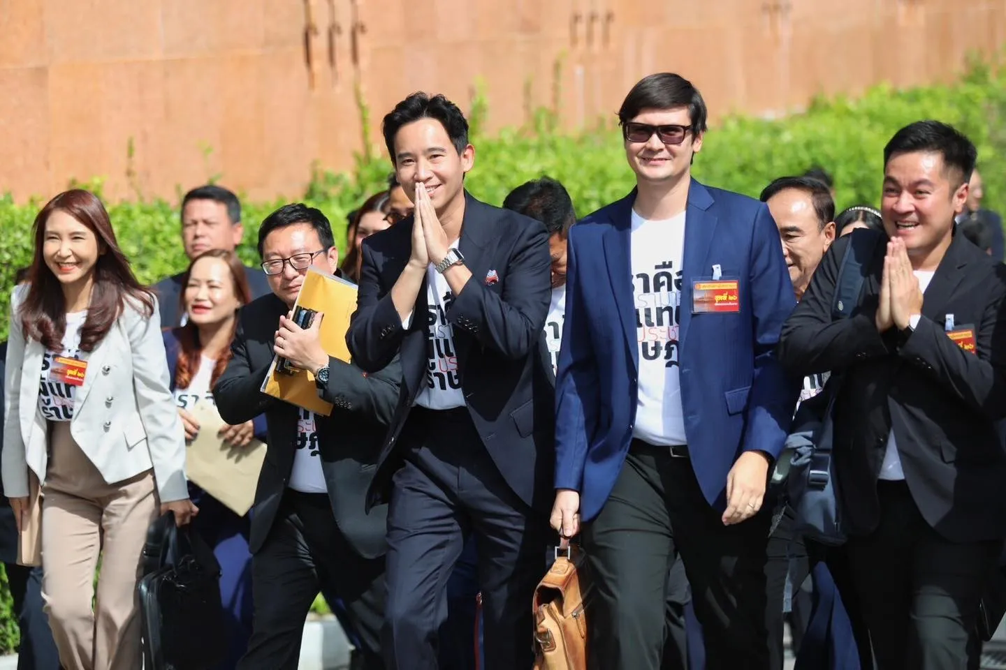 Pita Limjaroenrat and Move Forward Party Mps, wearing T-shirts bearing the message: “We are MPs Elected by the People.”