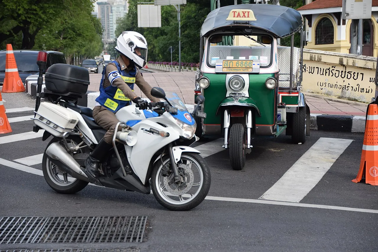 Policeman riding a motorbike in Thailand
