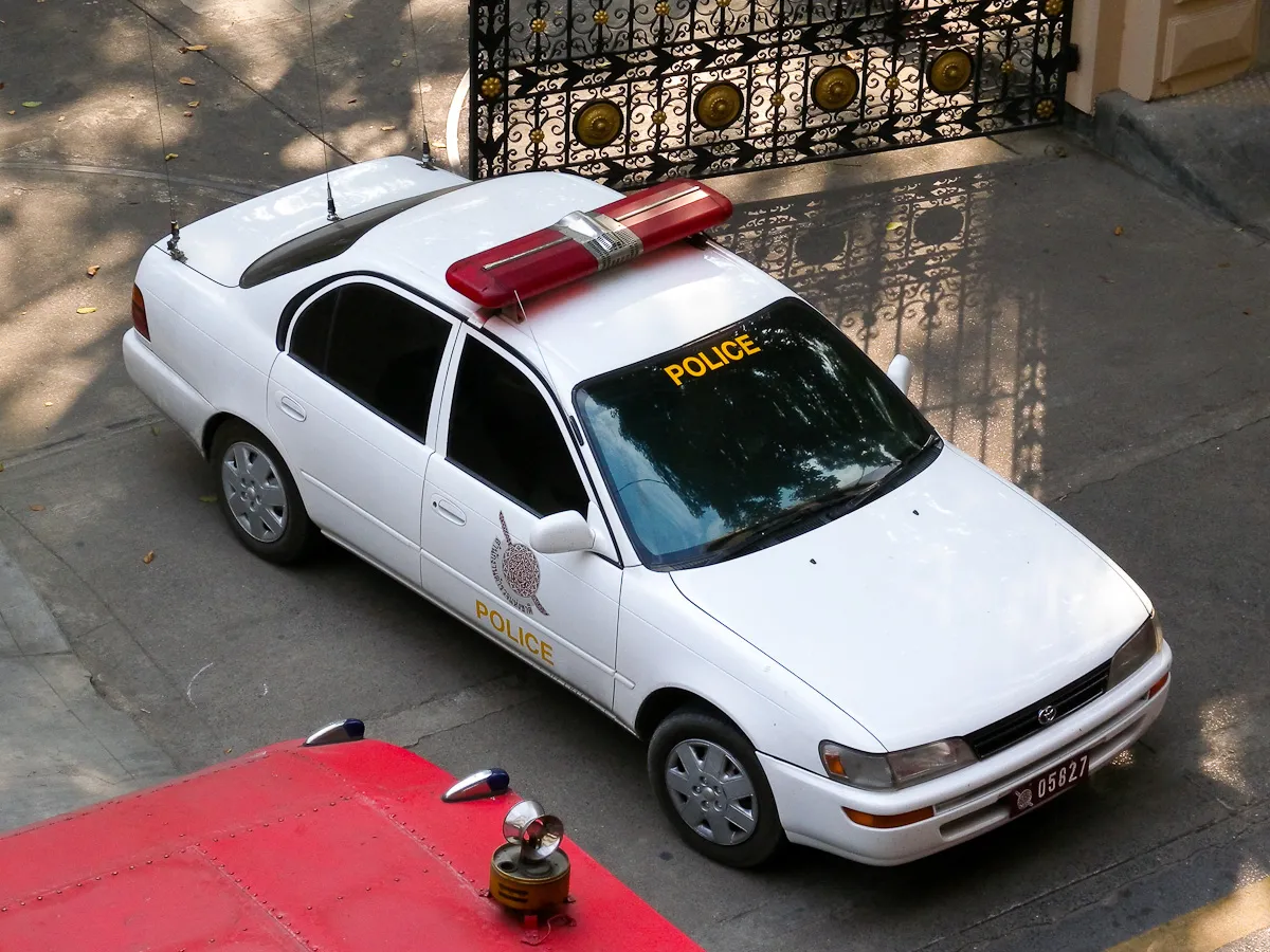 Royal Thai Police Toyota Corolla leaving the Police Headquarters on Ploen Chit Road, Bangkok