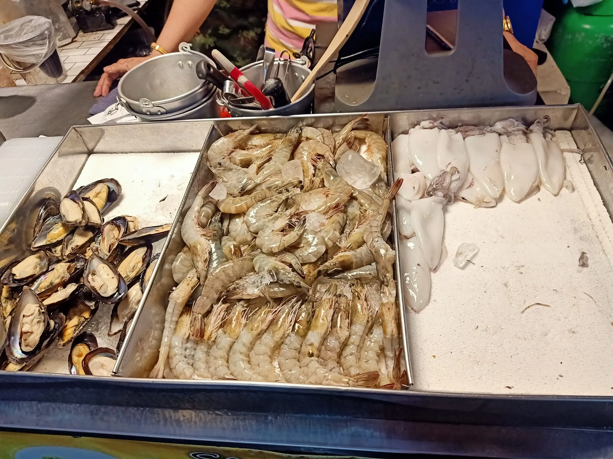 Seafood vendor at a night market in Samut Prakan.
