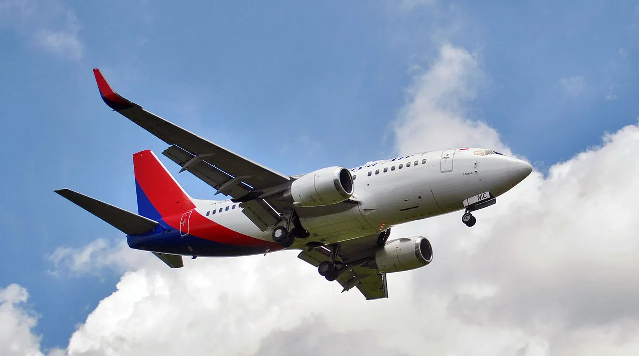 Sriwijaya Air Boeing 737-500 (PK-CMC) landing at Ngurah Rai International Airport (Denpasar International Airport), in Bali, Indonesia