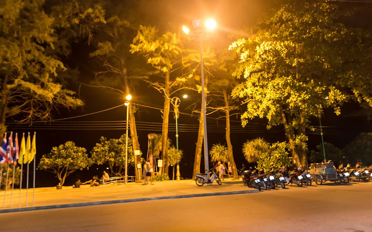 Motorbikes parked on a street at night in Patong, Kathu, Phuket.