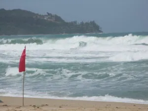 Strong waves and red flag on Surin Beach in Phuket.