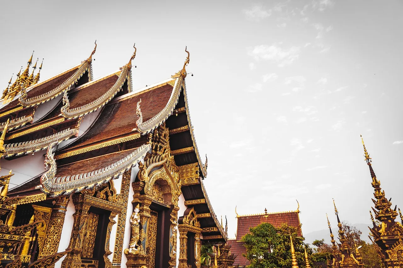 Buddhist Thai temple with ornate roof.