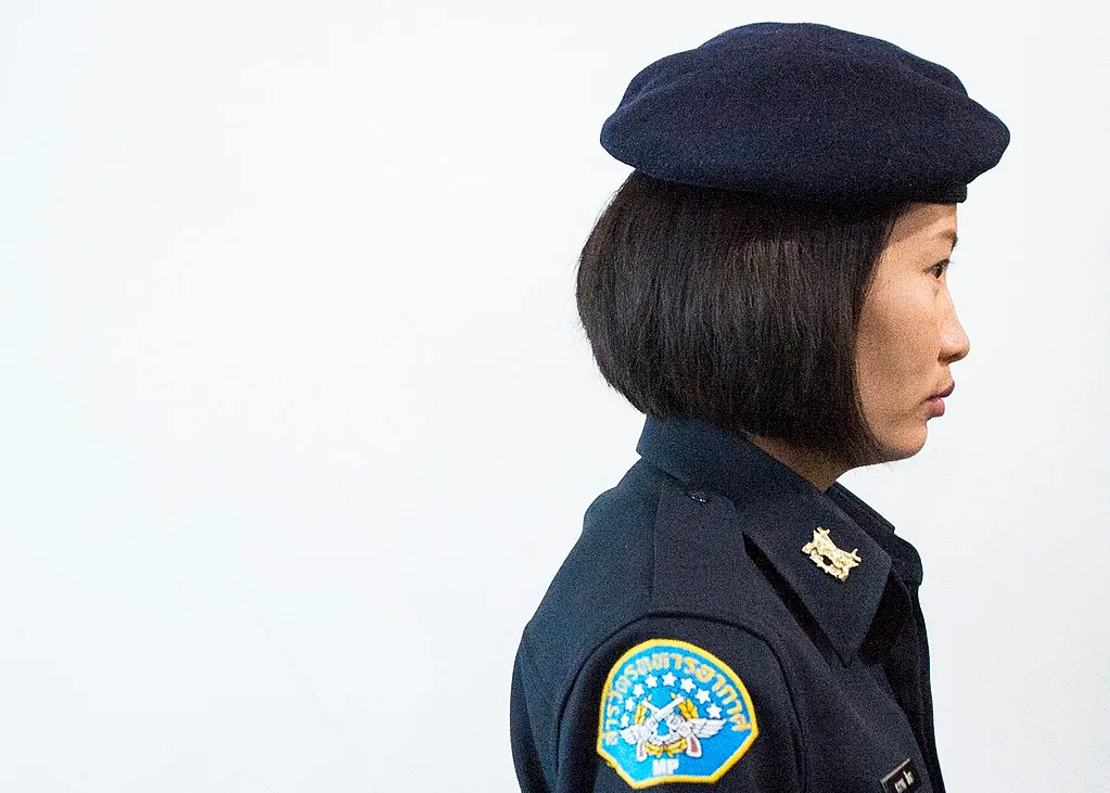 Thai female soldier stands watch in Bangkok