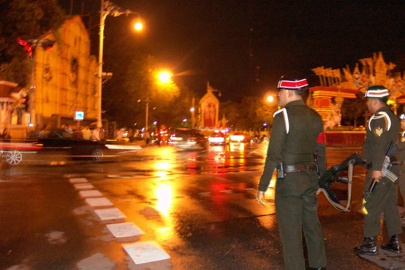 The military leaders on their way from the royal palace as military police look on during a coup d'etat in Thailand