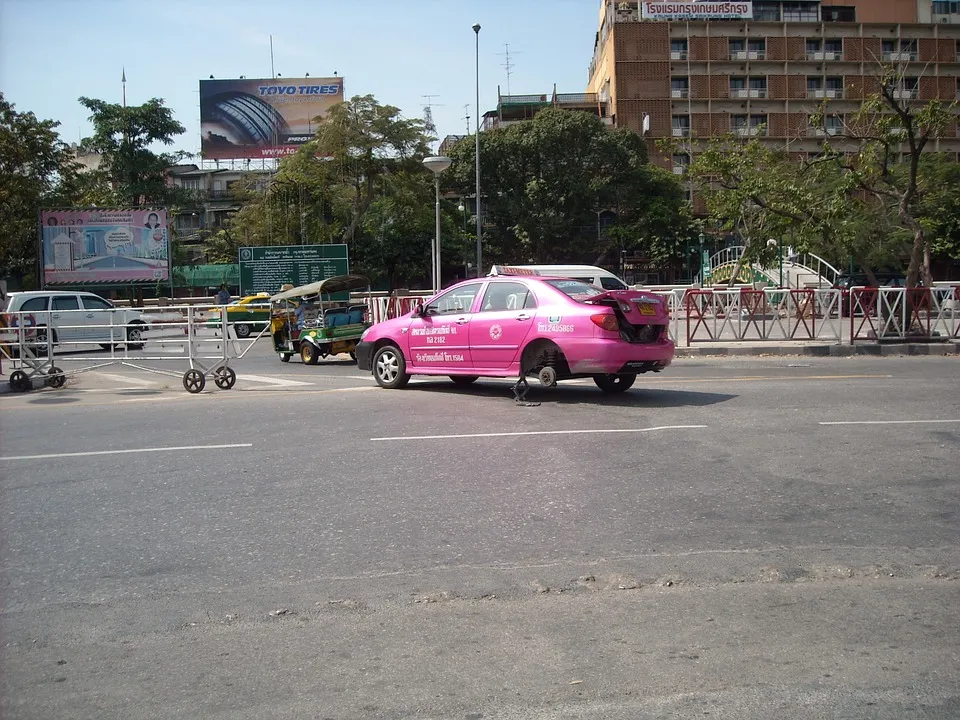 Pink taxi changing tires
