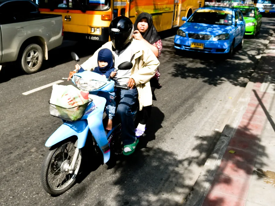 Three Muslims riding a Motorcycle in Ramkhamhaeng Road, Bangkok
