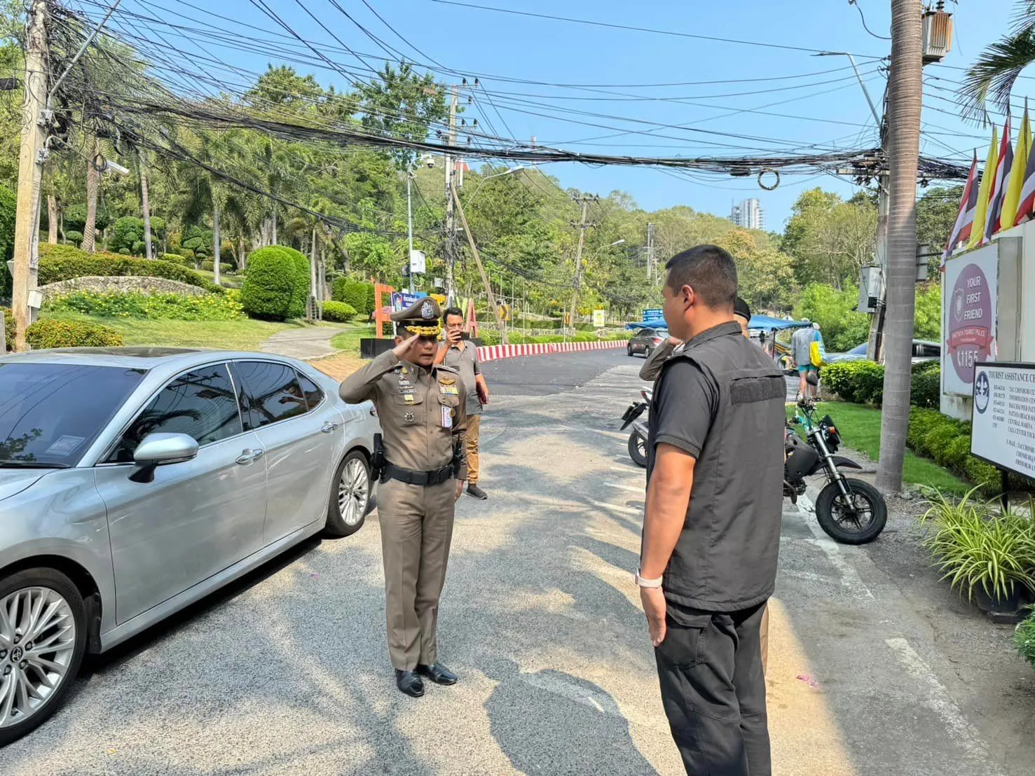 Thai police officers and a police car in Pattaya.