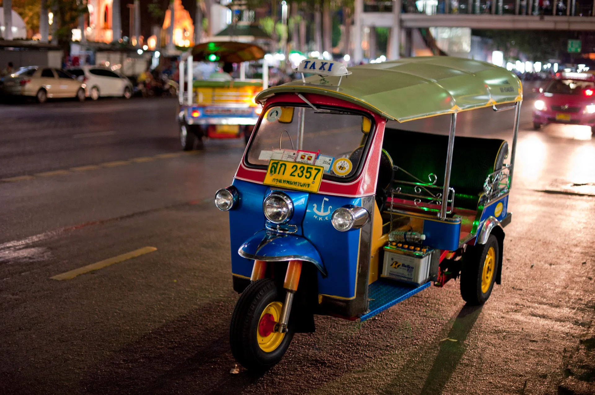 Riding a tuk-tuk at night in Bangkok.