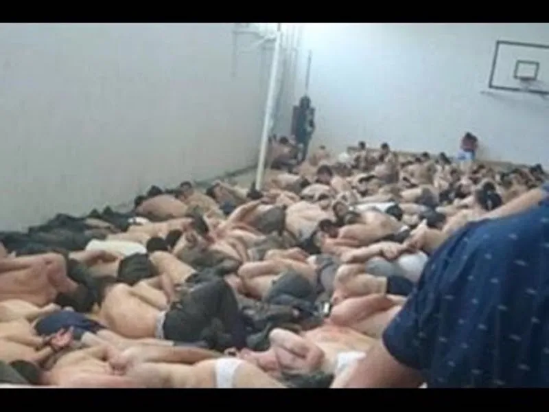 Turkish prisoners handcuffed and herded