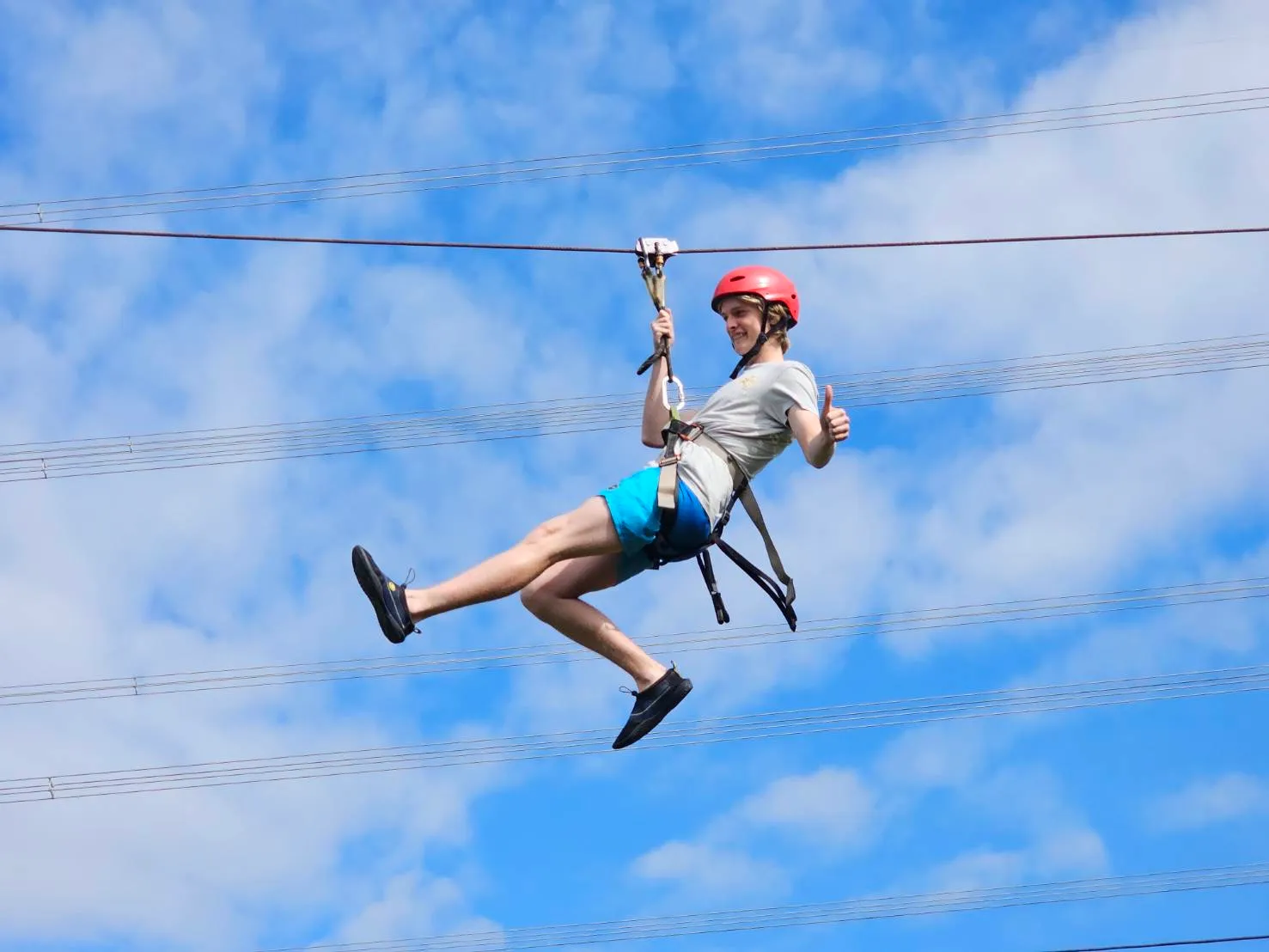 Tourist on a zip line in Thailand.