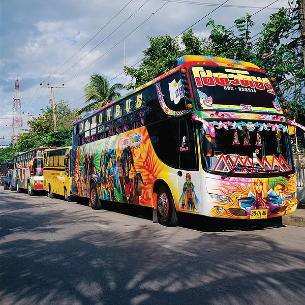 Funny multi-coloured long distance buses in Hua Hin, Thailand.