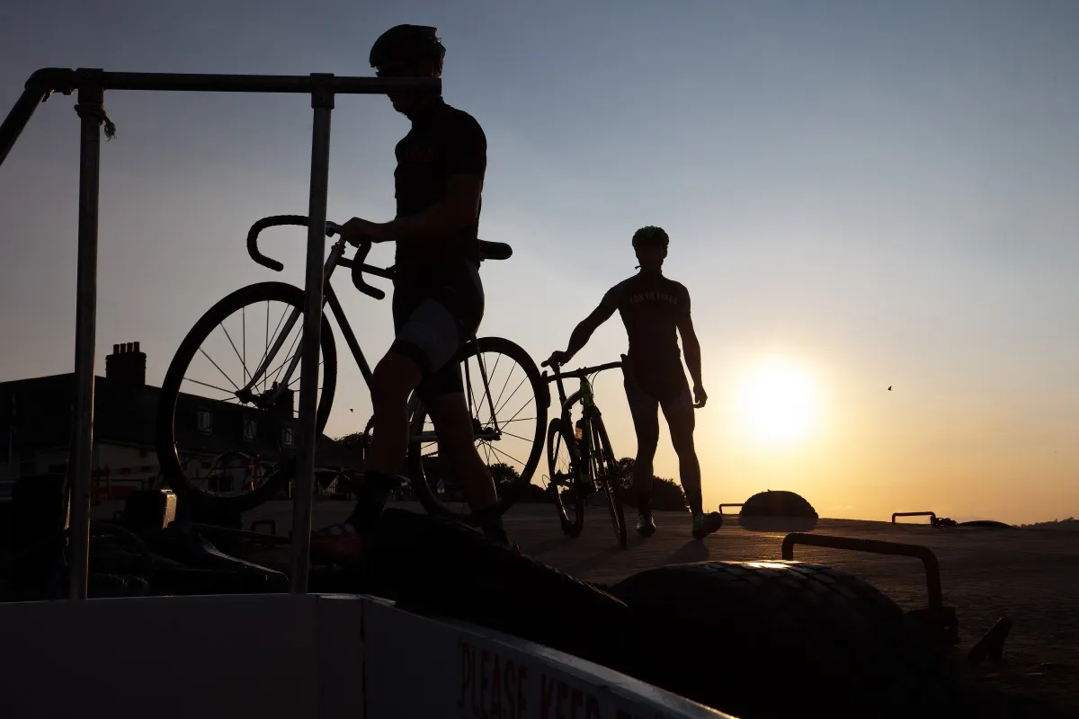 Two cyclists at sunset