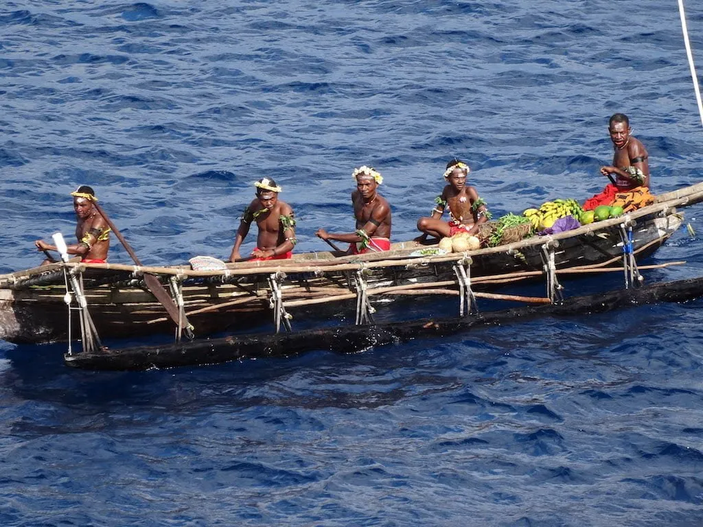 Natives in a boat in Papua New Guinea