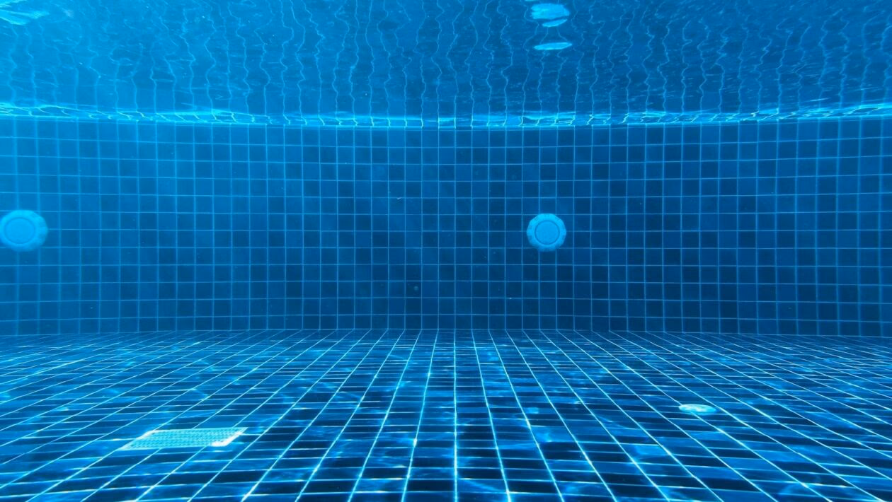 blue swimming pool with water